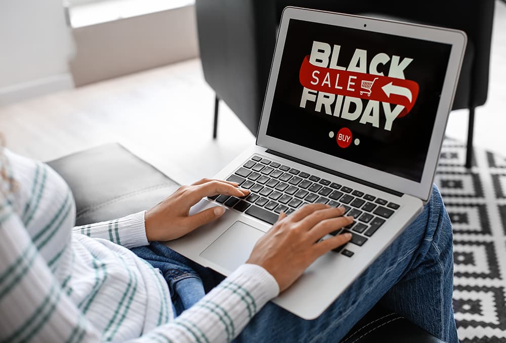 Man on computer looking at black friday